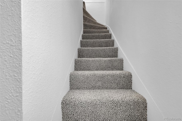 2803 N Cascade Ave, Colorado Springs, CO 80907 - stairs with a textured wall