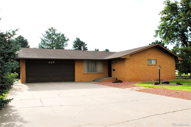 ranch-style house featuring a garage