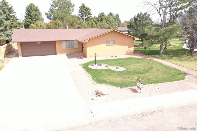 ranch-style house with a front yard and a garage