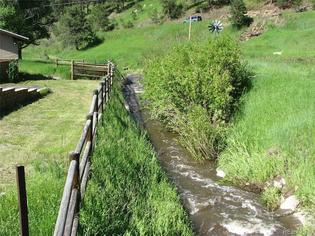 view of yard with a water view