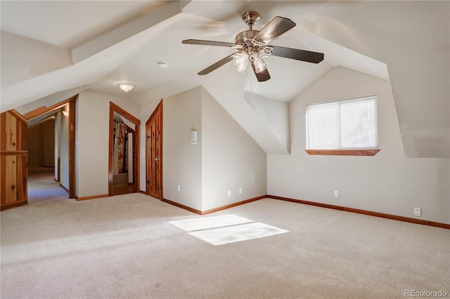 bonus room with carpet flooring, vaulted ceiling, and ceiling fan