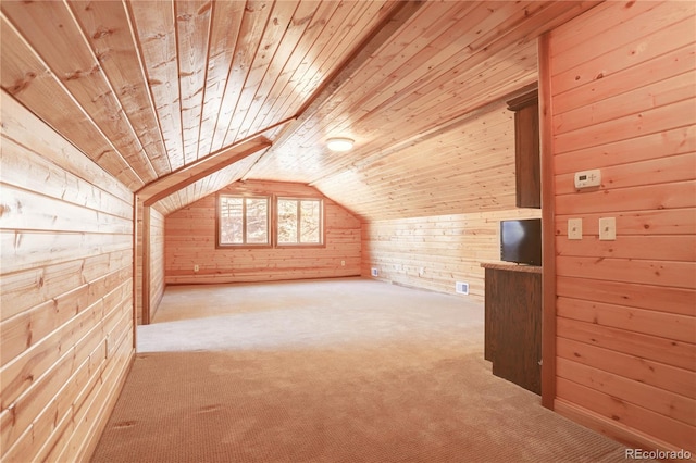 additional living space with wooden walls, light carpet, and wooden ceiling