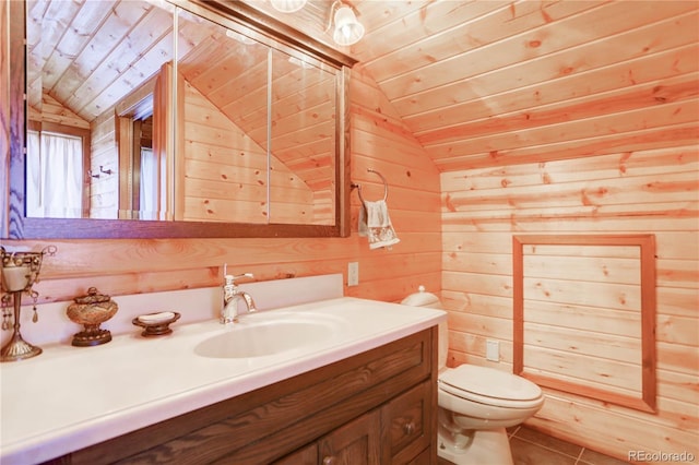 bathroom featuring wood ceiling, wooden walls, lofted ceiling, toilet, and vanity