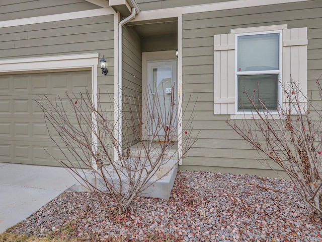 property entrance featuring a garage