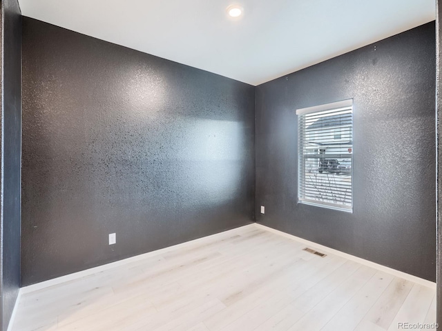 empty room with light wood-type flooring