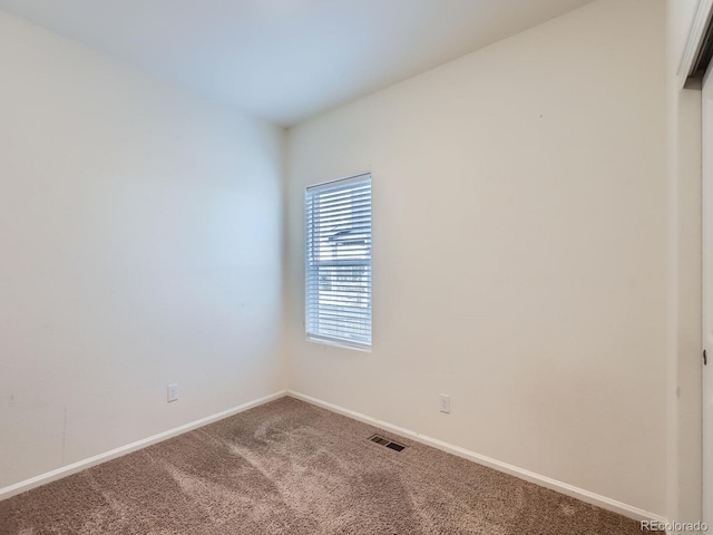 unfurnished room with carpet floors