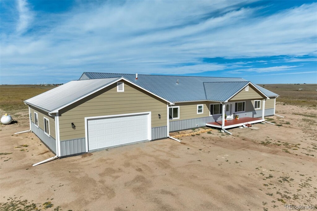41095 Alta Vista Rd, Ramah, CO 80832 - view of front of home featuring a garage and metal roof
