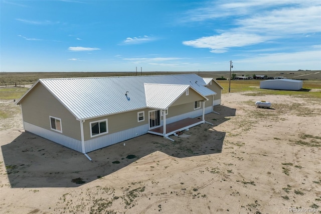 birds eye view of property with a rural view