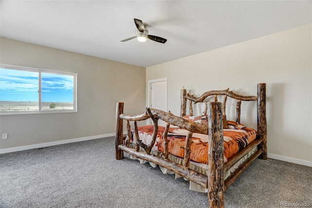 bedroom with baseboards, a ceiling fan, and carpet