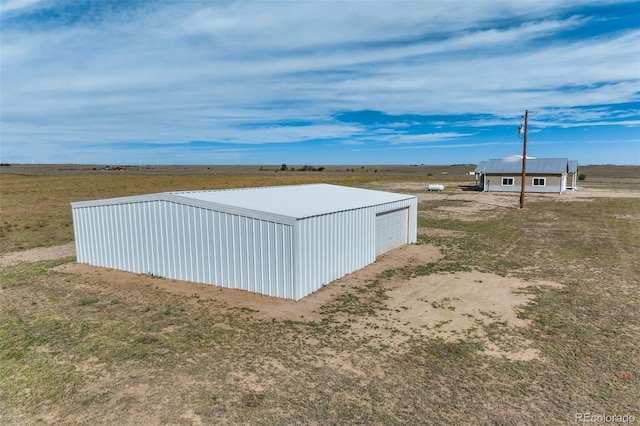 view of outbuilding with a rural view