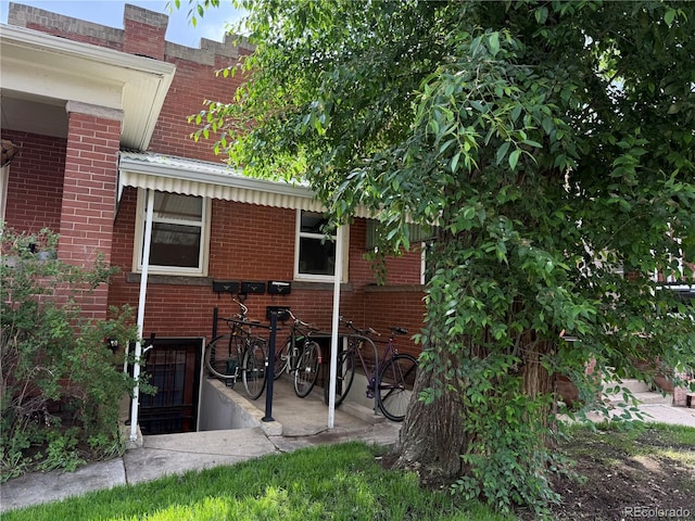 1414 S Pearl St, Denver, CO 80210 - rear view of house featuring brick siding
