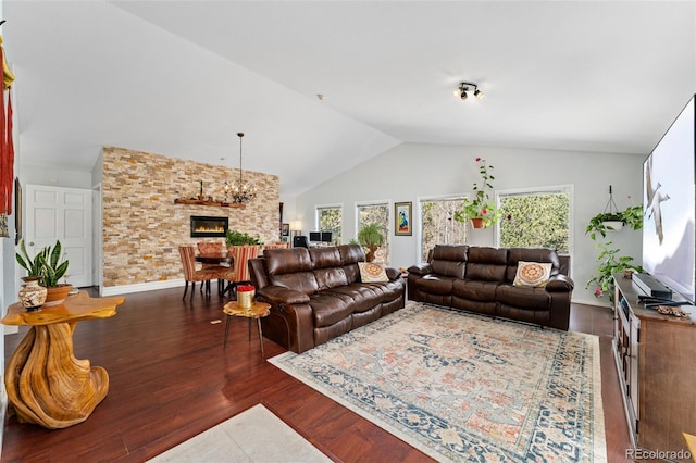 11398 Ranch Elsie Rd, Golden, CO 80403 - living room with a fireplace, lofted ceiling, and wood finished floors