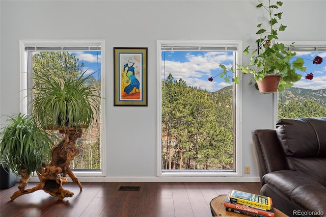 11398 Ranch Elsie Rd, Golden, CO 80403 - sitting room with plenty of natural light, hardwood / wood-style flooring, and visible vents