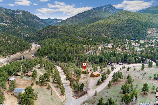 11398 Ranch Elsie Rd, Golden, CO 80403 - drone / aerial view with a forest view and a mountain view