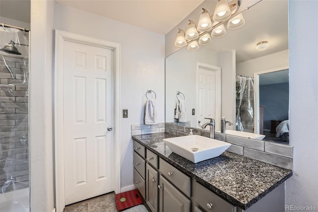 ensuite bathroom with vanity and ensuite bath