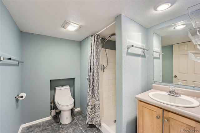 bathroom with a textured ceiling, toilet, vanity, tile patterned floors, and a stall shower