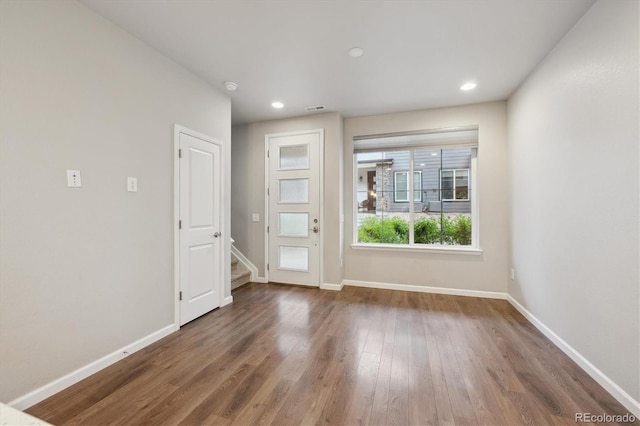 9269 Garnett St Unit C, Arvada, CO 80007 - unfurnished living room featuring wood finished floors, baseboards, stairs, and recessed lighting