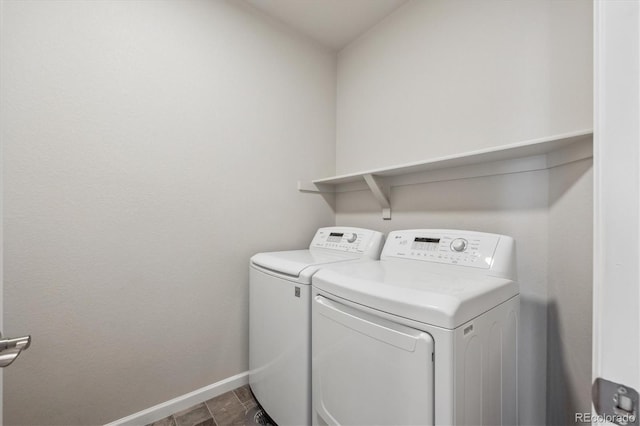 9269 Garnett St Unit C, Arvada, CO 80007 - washroom featuring washer and clothes dryer and baseboards