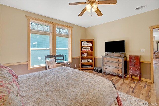 bedroom with ceiling fan and light wood-type flooring