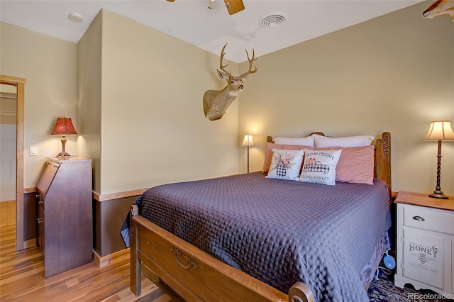 bedroom featuring ceiling fan and light hardwood / wood-style floors