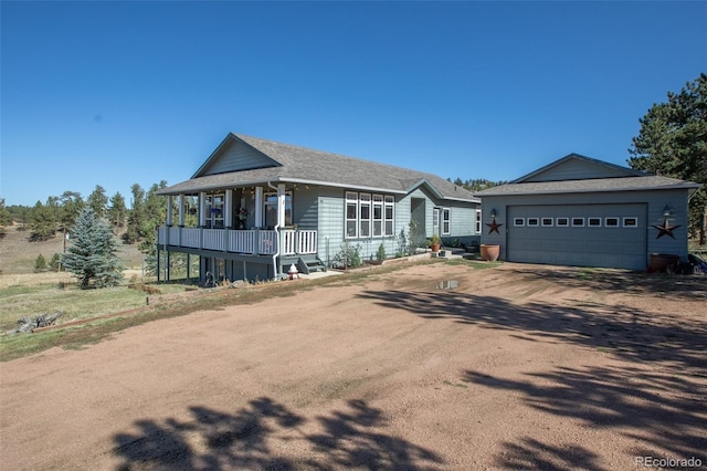 view of front of property with a garage and covered porch