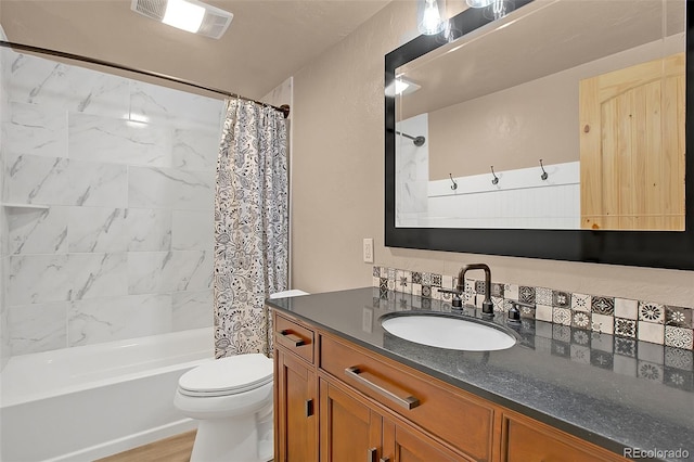 full bathroom with wood-type flooring, vanity, toilet, and shower / bath combination with curtain