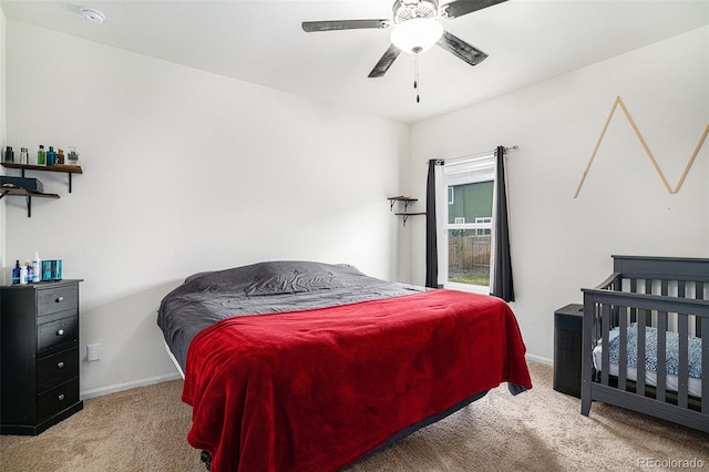 carpeted bedroom with ceiling fan