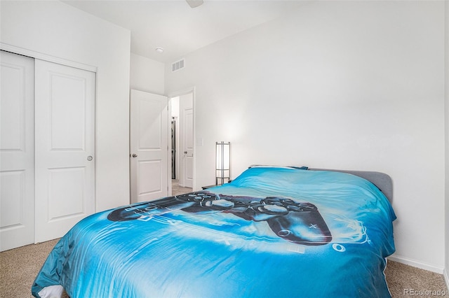 carpeted bedroom featuring a closet