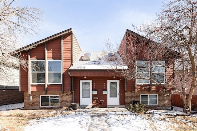 view of front of home featuring brick siding