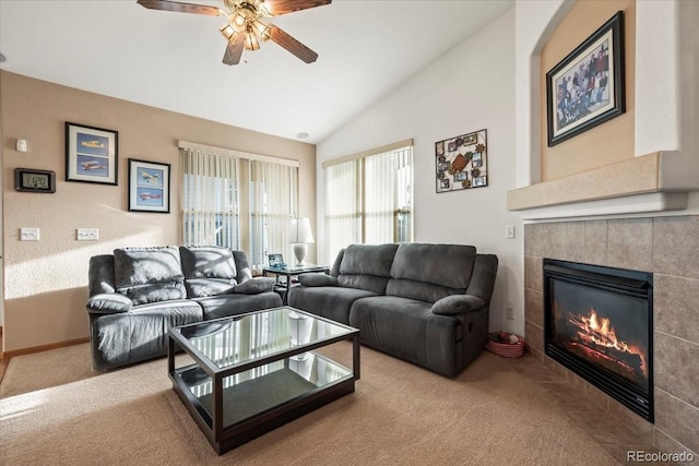 1434 Hickory Dr, Erie, CO 80516 - living room featuring ceiling fan, light colored carpet, vaulted ceiling, and a tile fireplace