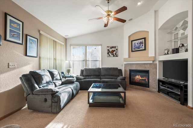 1434 Hickory Dr, Erie, CO 80516 - carpeted living room with ceiling fan, lofted ceiling, and a tile fireplace