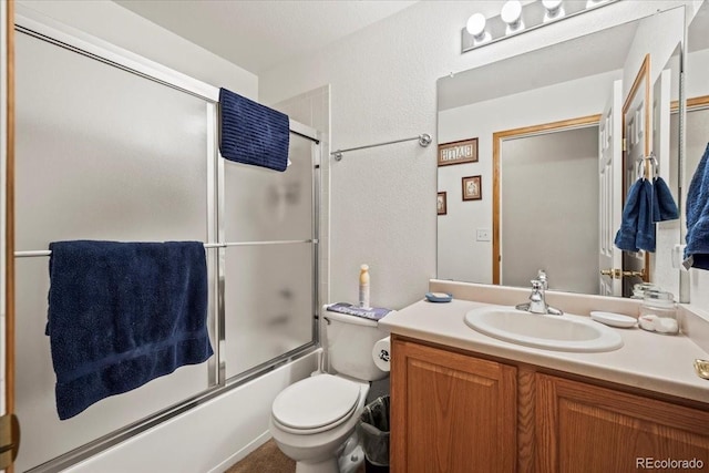1434 Hickory Dr, Erie, CO 80516 - full bathroom with toilet, vanity, and shower / bath combination with glass door