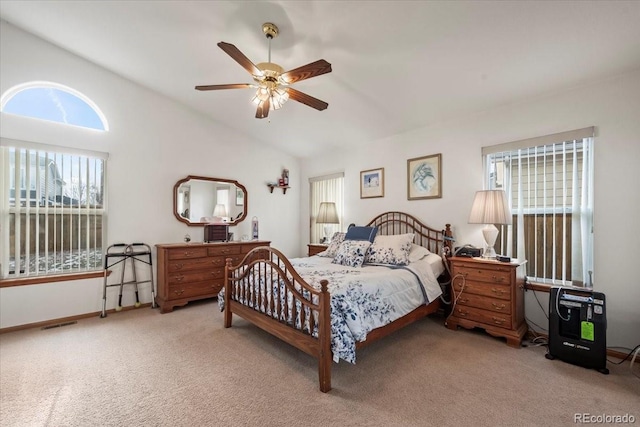 1434 Hickory Dr, Erie, CO 80516 - bedroom with ceiling fan, multiple windows, light carpet, and vaulted ceiling