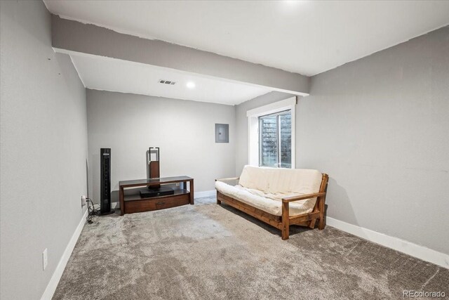 1434 Hickory Dr, Erie, CO 80516 - living area with carpet, beam ceiling, and electric panel