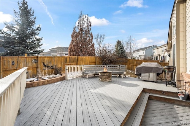 1434 Hickory Dr, Erie, CO 80516 - wooden deck with a fire pit and area for grilling