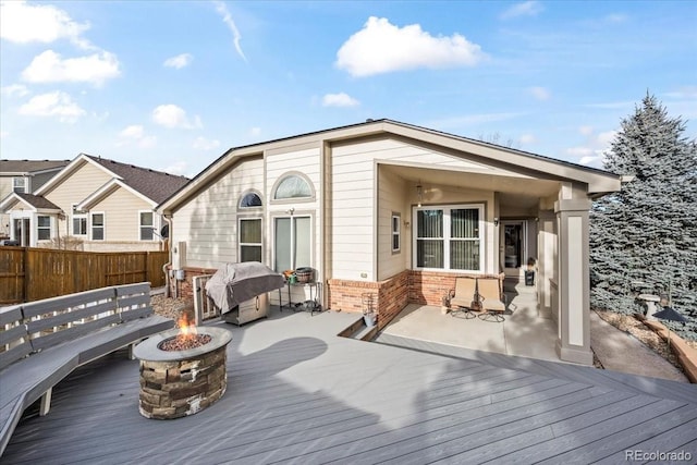 1434 Hickory Dr, Erie, CO 80516 - wooden deck featuring a grill and an outdoor fire pit