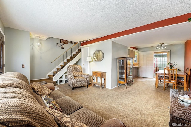 628 S Carr St, Lakewood, CO 80226 - living area featuring stairs, light colored carpet, a textured ceiling, a ceiling fan, and baseboards
