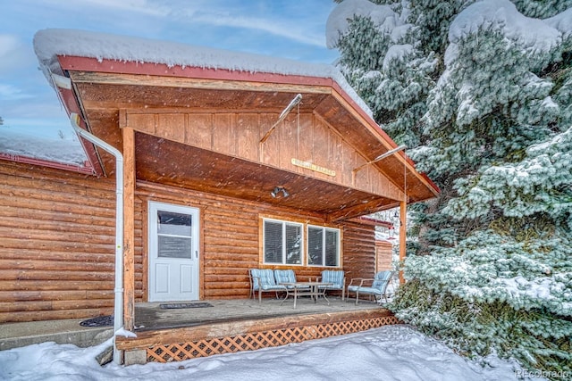 view of snow covered house