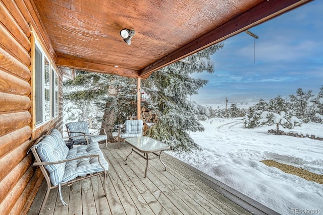 view of snow covered deck