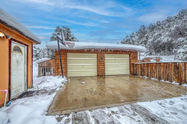 view of snow covered garage