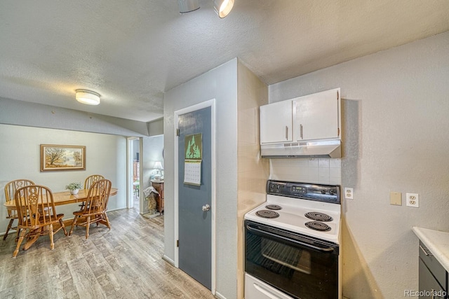 kitchen with light hardwood / wood-style floors, white range with electric cooktop, white cabinets, a textured ceiling, and backsplash