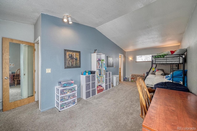 carpeted bedroom with lofted ceiling and a textured ceiling