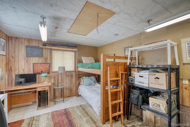 bedroom with wooden walls