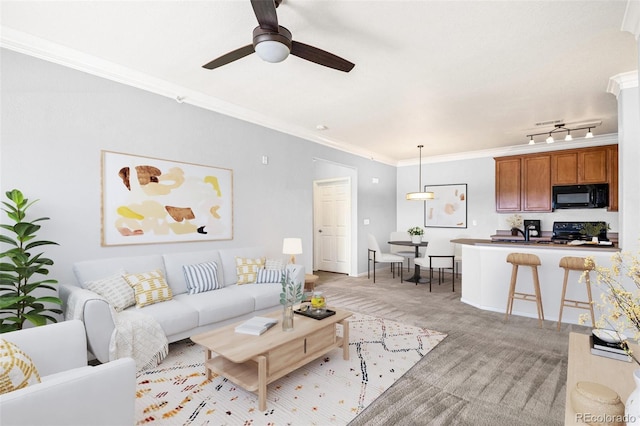 2662 S Cathay Way Unit 302, Aurora, CO 80013 - living area featuring ornamental molding, light carpet, ceiling fan, and baseboards
