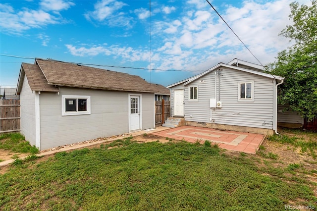 436 S 4th Ave, Brighton, CO 80601 - rear view of house featuring an outbuilding and a patio