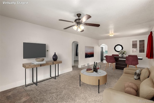 436 S 4th Ave, Brighton, CO 80601 - living area with arched walkways and a ceiling fan
