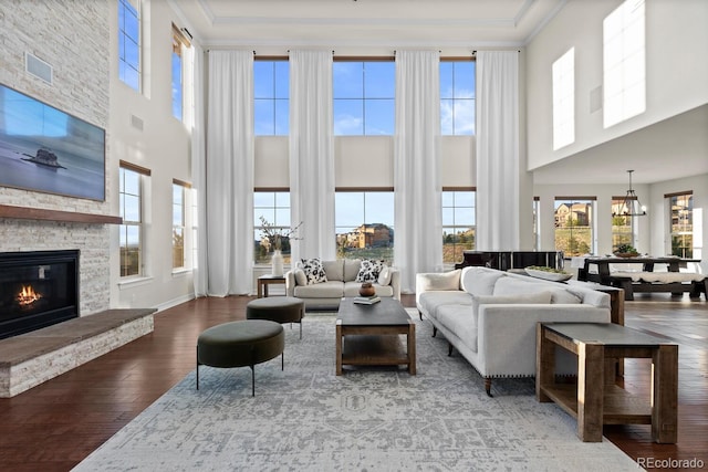771 Braesheather Pl, Highlands Ranch, CO 80126 - living room featuring a wealth of natural light, a towering ceiling, and hardwood / wood-style floors