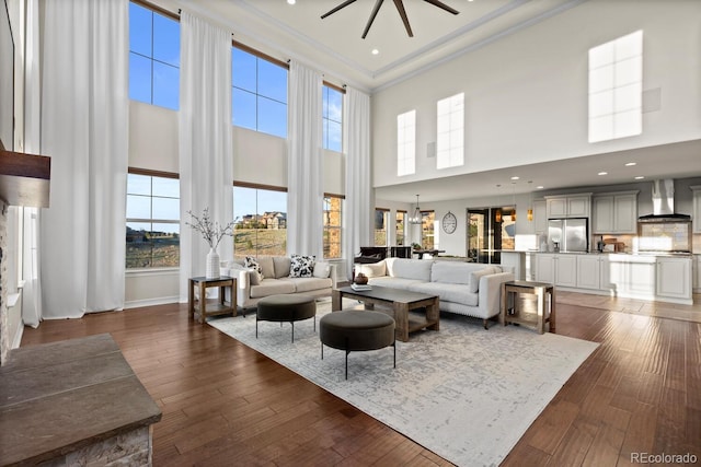 771 Braesheather Pl, Highlands Ranch, CO 80126 - living room featuring a wealth of natural light, crown molding, and a high ceiling