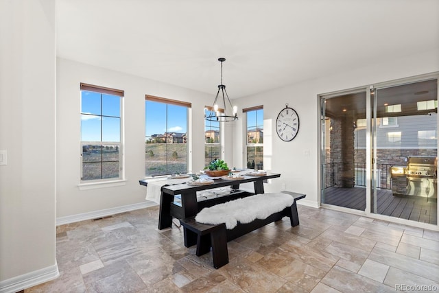 771 Braesheather Pl, Highlands Ranch, CO 80126 - dining area with an inviting chandelier, visible vents, baseboards, and stone tile flooring