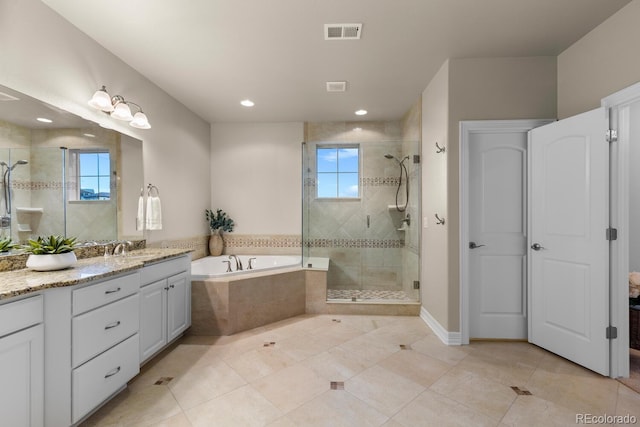 771 Braesheather Pl, Highlands Ranch, CO 80126 - full bathroom featuring vanity, visible vents, a stall shower, tile patterned flooring, and a bath